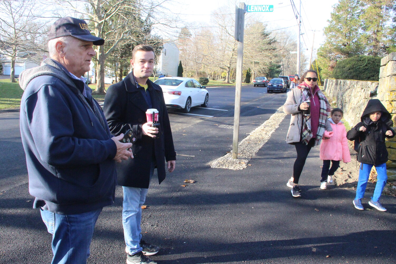 SURVEYING IMPROVEMENTS: Ward 5 Councilman Ed Ladouceur and Warwick Neck Elementary Principal Frank Galligan stand on a widened section of Rocky Point Avenue that is designed as a drop off and pick up for students. (Warwick Beacon photos)